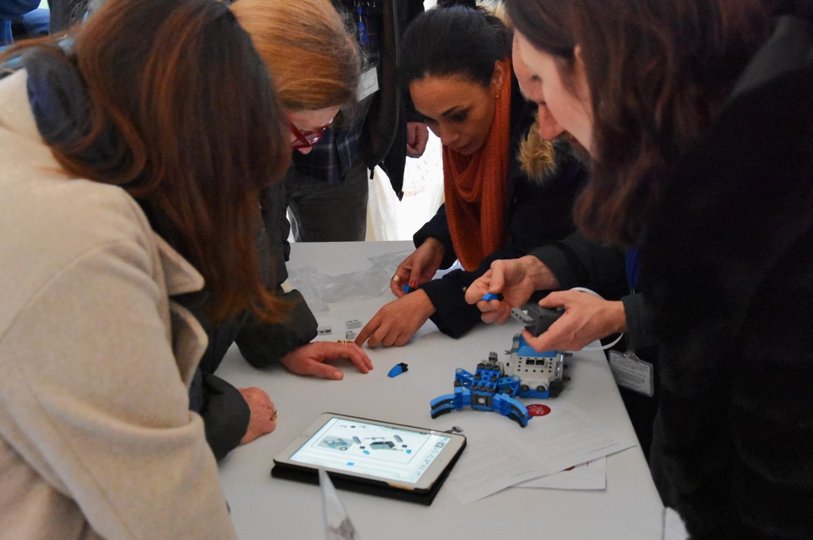 Participants assembling and programming a small robot