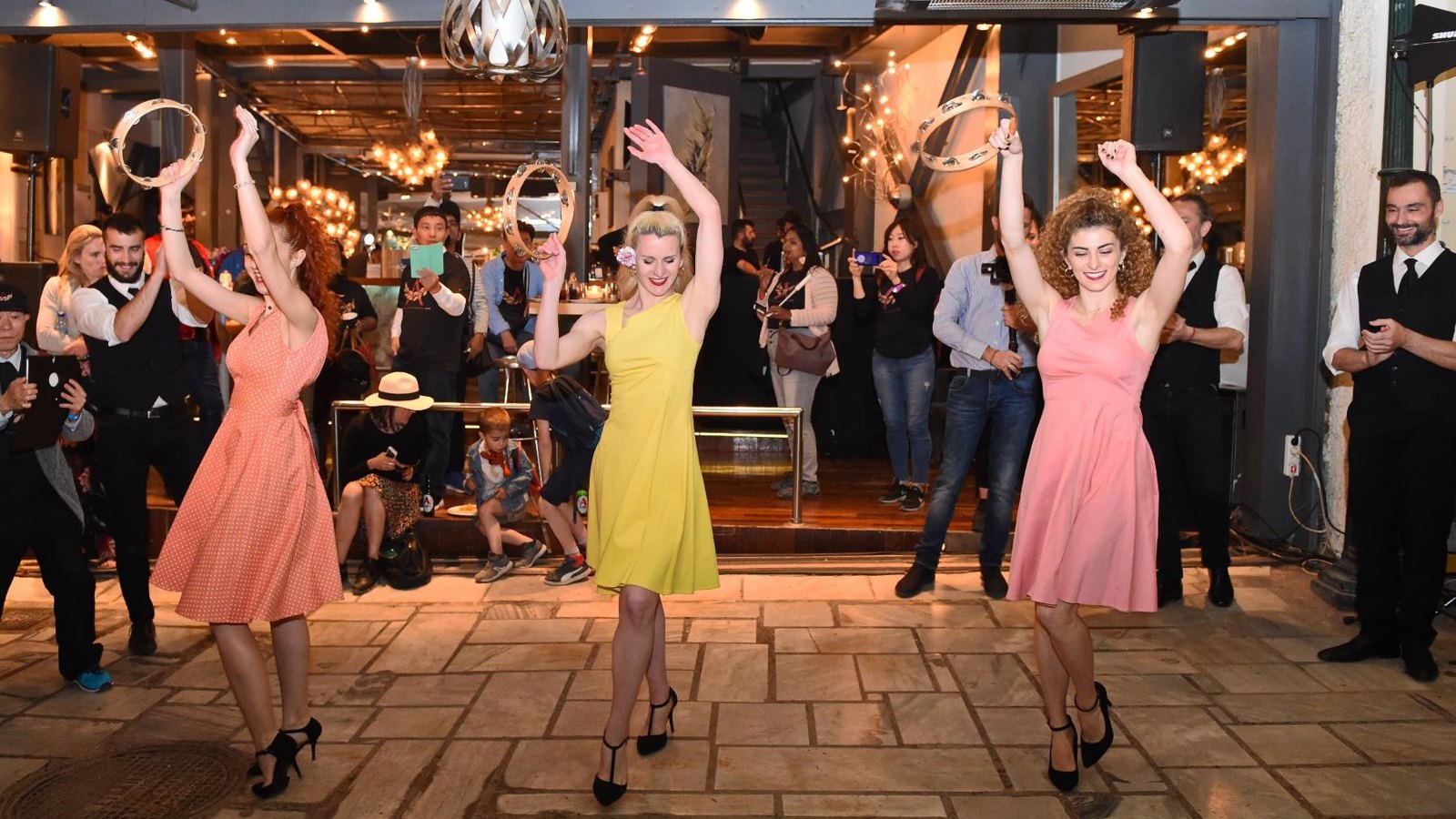 Guests joining a Greek wedding-style dance