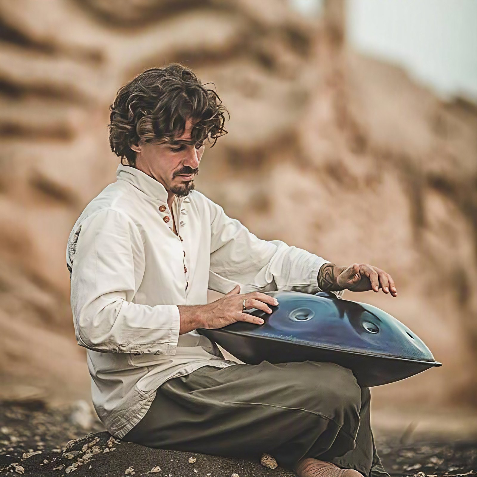 Musician playing a handpan outdoors