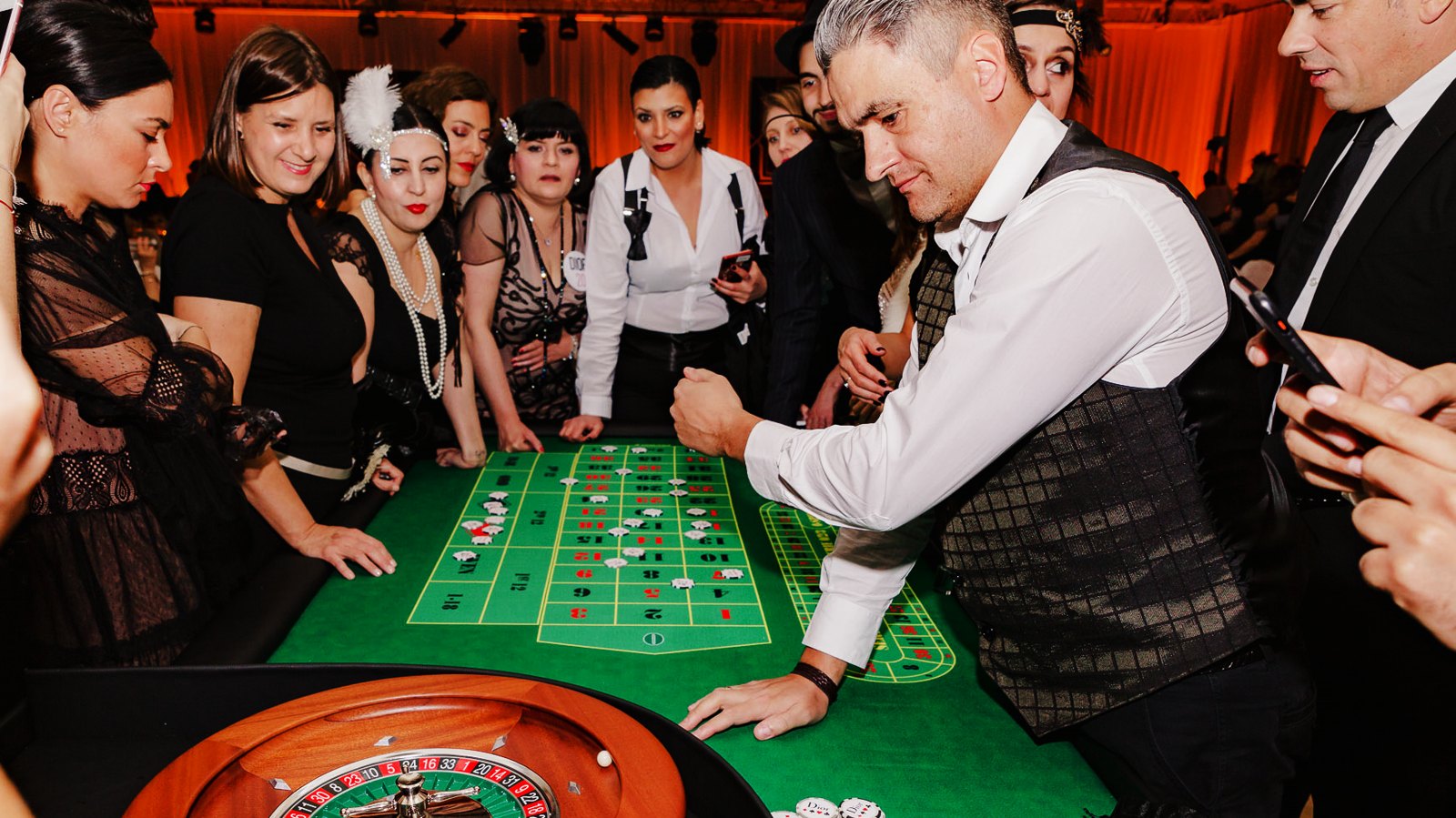 Guests playing roulette with a croupier