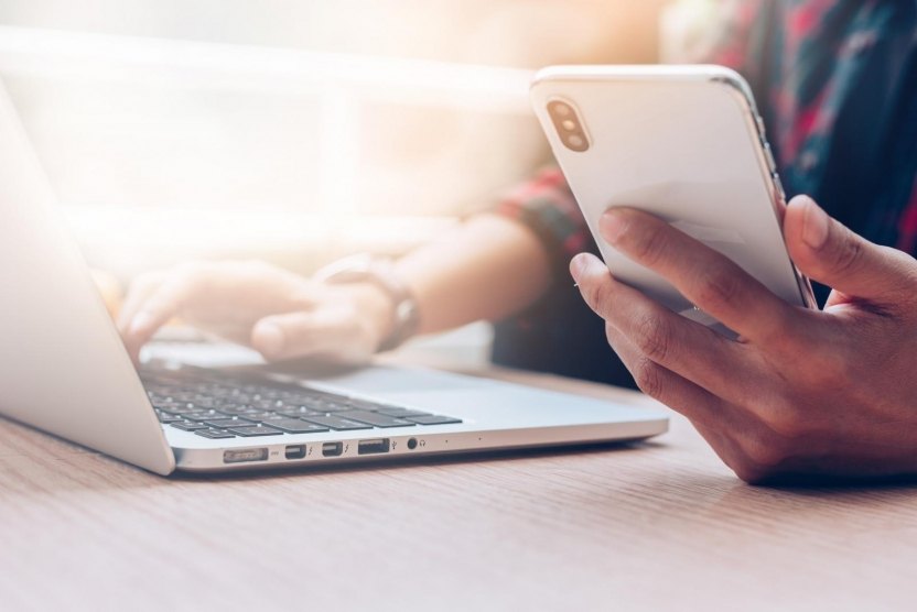 A participant using a smartphone for an online activity