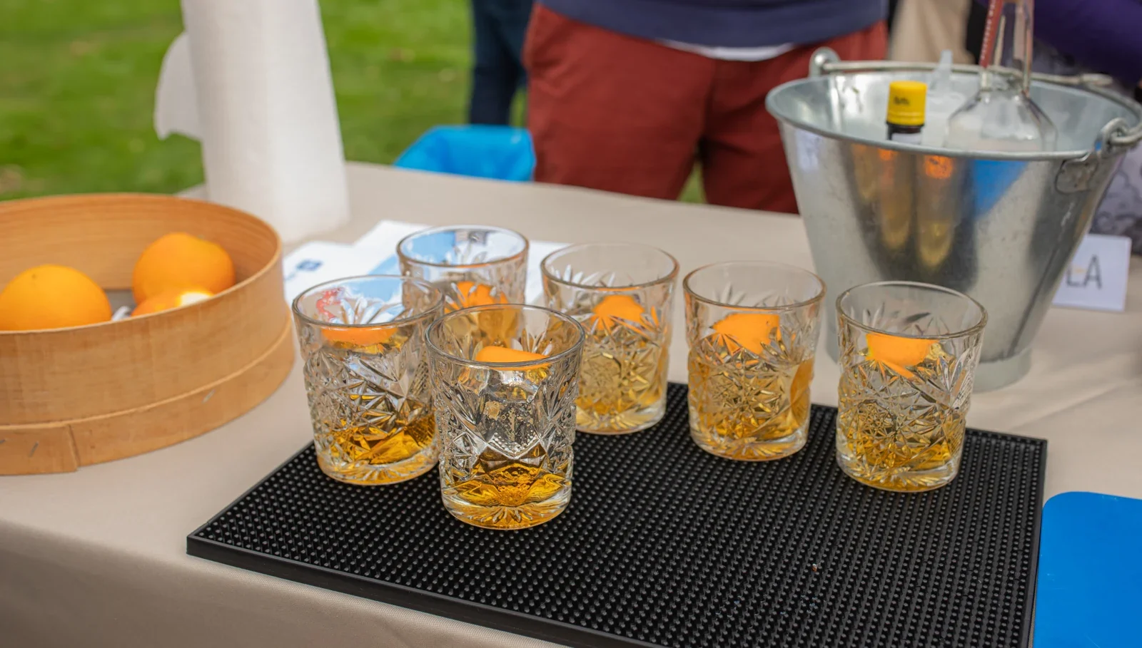 Cocktail glasses prepared on a bar mat