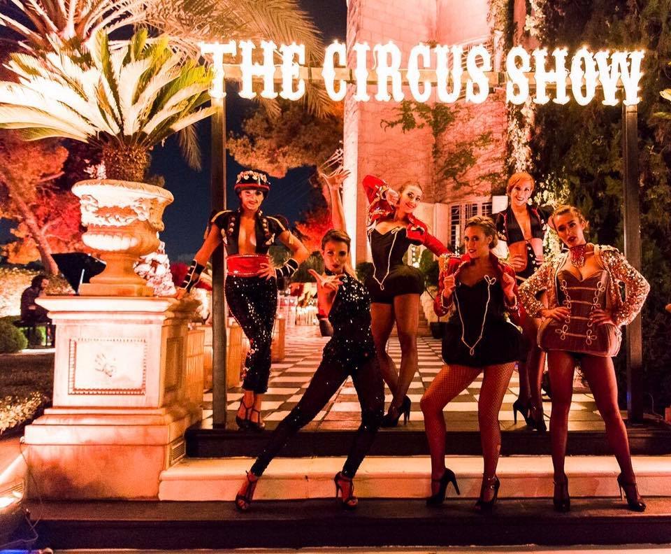 Circus performers at a themed event entrance