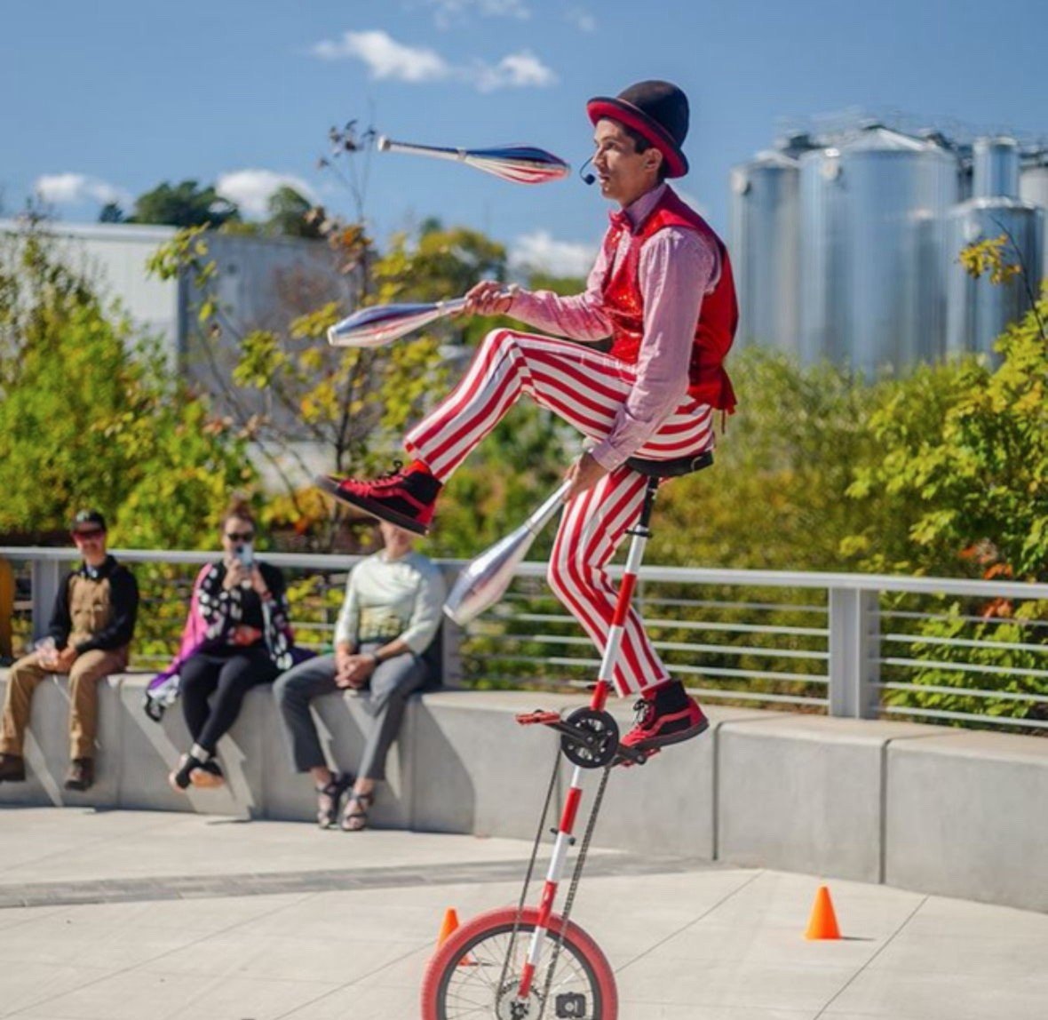 Circus performer balancing on a unicycle