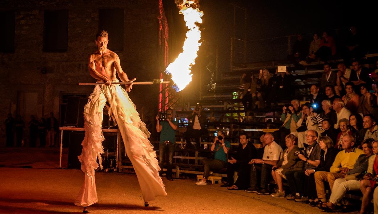 Fire performer in front of an outdoor audience