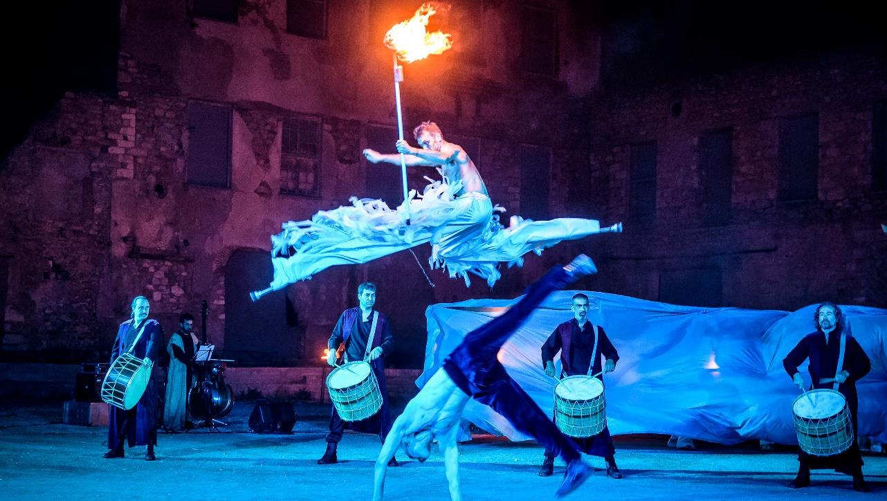 Mythological performance with fabric and flame