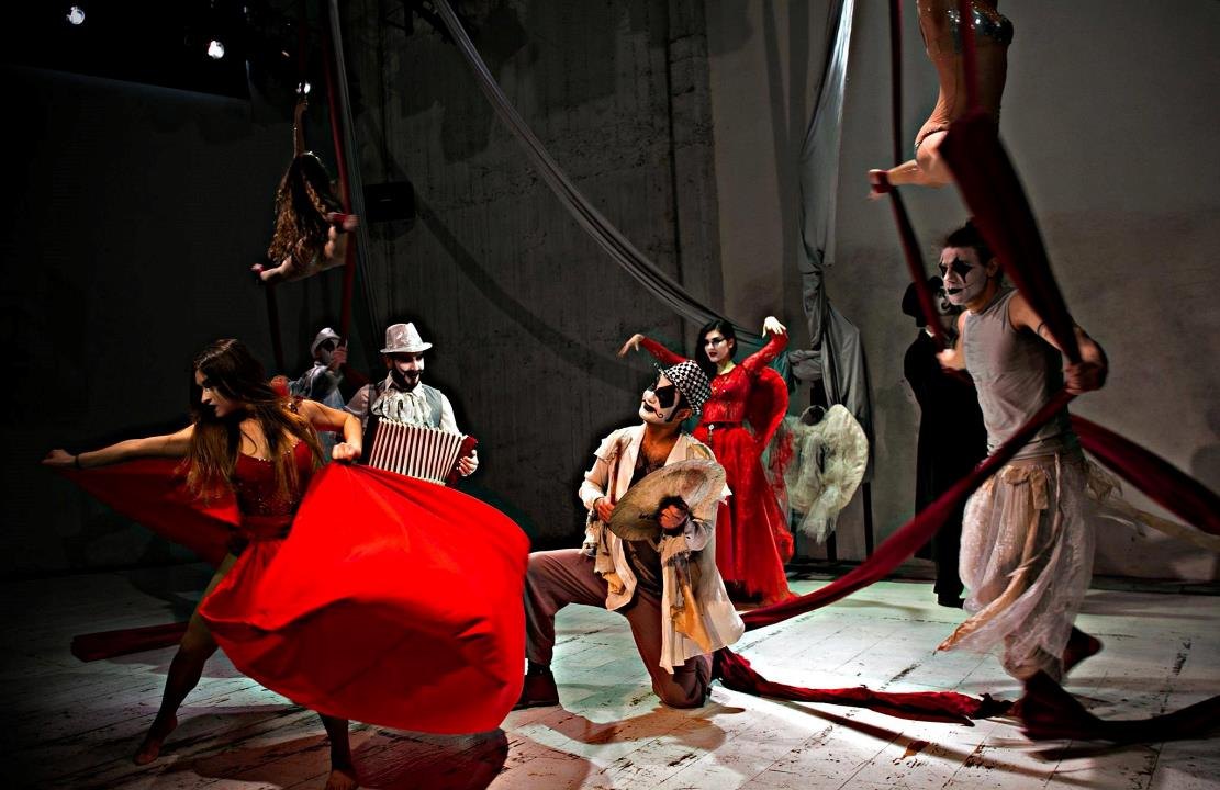 Circus ensemble rehearsing a theatrical performance