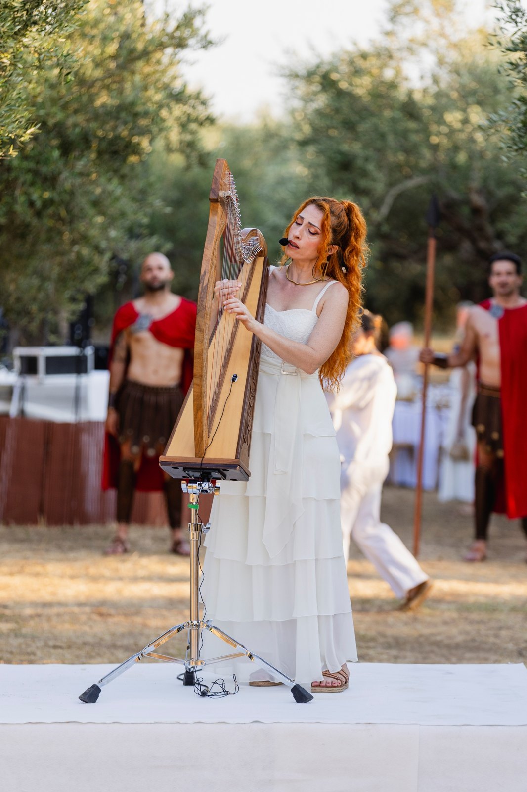 Harpist performing during an outdoor welcome