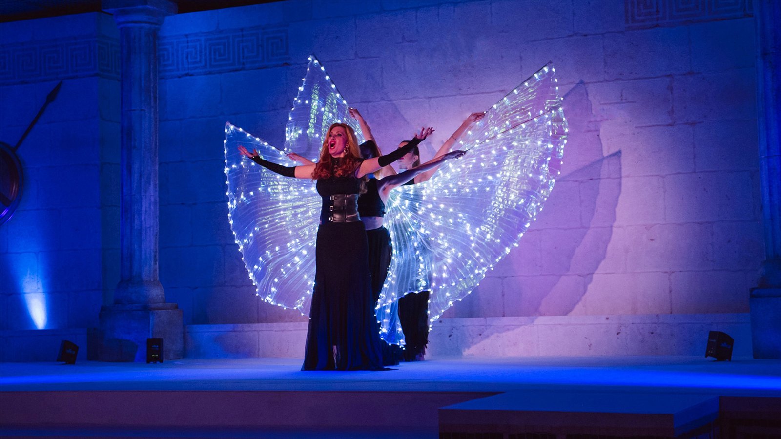 Soprano and illuminated-wing dancers performing The Siren’s Song