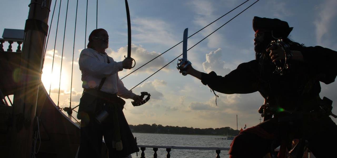 Performers staging a pirate sword fight