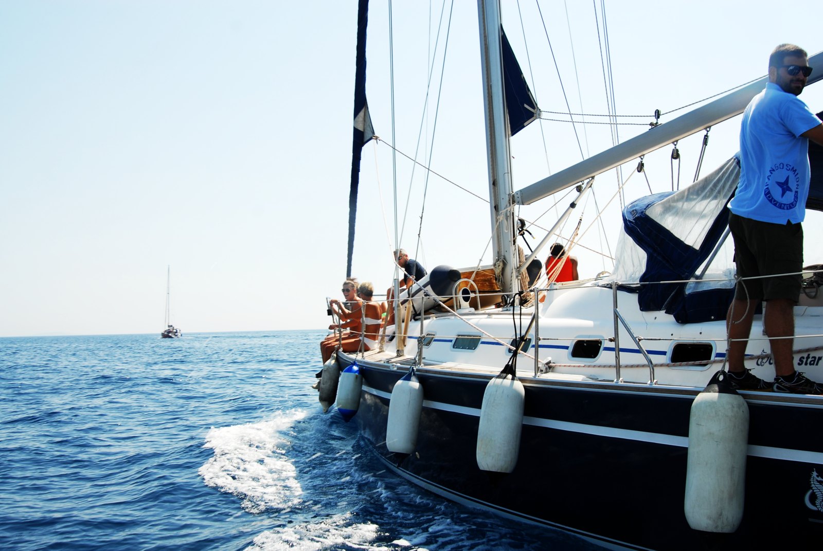 Participants aboard a sailing boat